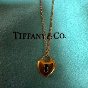 Tiffany &Co 18k gold necklace 16 in. heart shaped lock.